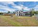Rear exterior view of a two-story home with a screened-in pool at 1840 Lillian Dr, St Cloud, FL 34771