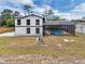 Two-story home with a screened-in pool enclosure and spacious yard at 1840 Lillian Dr, St Cloud, FL 34771