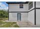 Side exterior view of a home with black and white trim at 1840 Lillian Dr, St Cloud, FL 34771