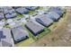 Aerial view of a neighborhood with well-maintained lawns and fenced backyards at 18851 Rawson St, Orlando, FL 32827