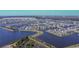 Aerial shot displays waterfront homes nestled along a tranquil lake, offering scenic views and peaceful living at 18851 Rawson St, Orlando, FL 32827