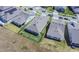 Aerial view of the neighborhood homes with grey roofs and fenced-in backyards at 18851 Rawson St, Orlando, FL 32827