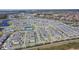 Wide aerial perspective of a neighborhood complete with tennis courts and a refreshing community pool at 18851 Rawson St, Orlando, FL 32827
