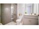 Modern bathroom with a glass-enclosed shower and neutral color palette at 18851 Rawson St, Orlando, FL 32827