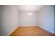 A dining room with hardwood floors and a modern chandelier at 18851 Rawson St, Orlando, FL 32827