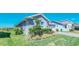 The home's exterior includes mature shrubs and landscaping at 18851 Rawson St, Orlando, FL 32827