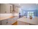 An open-concept kitchen featuring quartz countertops and stainless steel appliances at 18851 Rawson St, Orlando, FL 32827