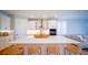 Bright kitchen with white cabinetry, large island with seating, and modern stainless steel appliances at 18851 Rawson St, Orlando, FL 32827