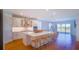 Spacious kitchen features a large quartz island, stainless steel appliances, and hardwood flooring at 18851 Rawson St, Orlando, FL 32827