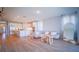 Open-concept living room, with plenty of natural light and hardwood floors, is adjacent to kitchen at 18851 Rawson St, Orlando, FL 32827