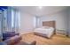 Relaxing bedroom features hardwood floors and large windows with natural light at 18851 Rawson St, Orlando, FL 32827