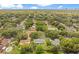 Expansive aerial view of a charming neighborhood featuring lush greenery and beautiful homes under a bright sky at 2095 Curry Ln, Orlando, FL 32812