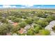 An aerial view showing a residential neighborhood with mature trees, well-kept lawns, and various rooftops at 2095 Curry Ln, Orlando, FL 32812
