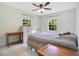 Inviting bedroom featuring natural light, tile floors, and comfortable furnishings at 2095 Curry Ln, Orlando, FL 32812