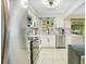 Well-lit kitchen with stainless steel appliances and ample countertop space, perfect for cooking at 2095 Curry Ln, Orlando, FL 32812