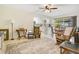 Open living area with a view of the kitchen and dining area and natural light, perfect for entertaining at 2095 Curry Ln, Orlando, FL 32812