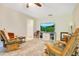 Spacious living area with comfortable seating, a large TV, and neutral-toned decor at 2095 Curry Ln, Orlando, FL 32812