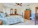 Spacious main bedroom featuring natural light, tile floors, and ample furniture at 2095 Curry Ln, Orlando, FL 32812