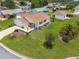 Lovely home showcasing a well-maintained lawn and mature landscaping from above at 2167 Kerwood Loop, The Villages, FL 32162