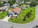 Aerial view of a house on a cul-de-sac with green landscaping and a well-manicured lawn at 2167 Kerwood Loop, The Villages, FL 32162
