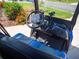 Bintelli 6 passenger golf cart featuring blue and black seats, steering wheel and navigation at 2167 Kerwood Loop, The Villages, FL 32162
