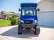 This fully street legal golf cart offers a front brush guard and stylish rims at 2167 Kerwood Loop, The Villages, FL 32162
