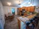 Functional kitchen with granite countertops, modern appliances, and ample seating at the breakfast bar at 2167 Kerwood Loop, The Villages, FL 32162