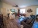 Inviting living room featuring comfortable seating, stylish decor, and plenty of space for entertaining guests at 2167 Kerwood Loop, The Villages, FL 32162