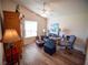 Comfortable office space with a ceiling fan, desk, chair, and ample natural light at 2167 Kerwood Loop, The Villages, FL 32162