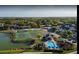 Aerial view of community amenities: pool, tennis, playground, clubhouse and lake at 2208 San Vittorino Cir # 104, Kissimmee, FL 34741