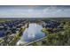 Aerial view of community with lake and many townhomes at 2208 San Vittorino Cir # 104, Kissimmee, FL 34741