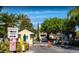 Community entrance featuring a gated access and well-maintained landscaping at 2208 San Vittorino Cir # 104, Kissimmee, FL 34741