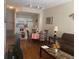Cozy living room with open dining area and adjacent kitchen, perfect for entertaining at 2208 San Vittorino Cir # 104, Kissimmee, FL 34741