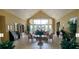 Inviting lobby with tile flooring, neutral decor, plants, and comfortable seating at 2208 San Vittorino Cir # 104, Kissimmee, FL 34741
