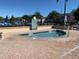 A small community hot tub is surrounded by a brick deck and has a No Diving sign at 2208 San Vittorino Cir # 104, Kissimmee, FL 34741