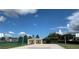 A beautiful community tennis court and beach volleyball court on a sunny day at 2208 San Vittorino Cir # 104, Kissimmee, FL 34741