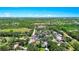 Wide aerial view showcasing the property, streets and lush landscapes of the surrounding area at 228 Ring Rd, Orlando, FL 32811