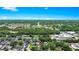 Expansive aerial view of the property highlighting its location amidst lush greenery and city features at 228 Ring Rd, Orlando, FL 32811