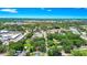 Aerial view of the home surrounded by mature trees in a lush neighborhood at 228 Ring Rd, Orlando, FL 32811