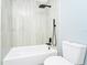 Bathroom featuring a modern white tiled shower and updated fixtures at 228 Ring Rd, Orlando, FL 32811