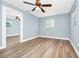 Bedroom with view to another bedroom and a ceiling fan at 228 Ring Rd, Orlando, FL 32811