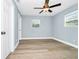 Light and bright bedroom with new ceiling fan and wood-look floors at 228 Ring Rd, Orlando, FL 32811