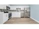 Contemporary kitchen with stainless steel appliances, accented by white cabinets and sleek flooring, creating a modern space at 228 Ring Rd, Orlando, FL 32811