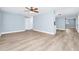 Large living room with wood look floors, neutral paint and natural light at 228 Ring Rd, Orlando, FL 32811