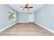 Living room featuring new flooring and a large bay window at 228 Ring Rd, Orlando, FL 32811
