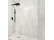 Bathroom featuring a modern white tiled shower and updated fixtures at 228 Ring Rd, Orlando, FL 32811