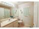Bathroom with modern fixtures, tile floors, and a tub and shower combination at 2309 Edmonton Ct, Clermont, FL 34711
