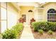 Close-up of the home's entrance highlighting landscaped walkway and charming front door at 2309 Edmonton Ct, Clermont, FL 34711