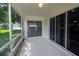Enclosed back patio with a view of the backyard and sliding doors for indoor-outdoor living at 2309 Edmonton Ct, Clermont, FL 34711