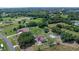 Wide aerial shot features home with a big lot with mature landscaping in a suburban neighborhood at 2500 Derby Dr, Kissimmee, FL 34744